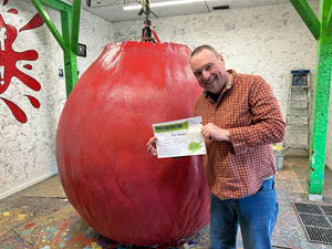 Scott holding his certificate